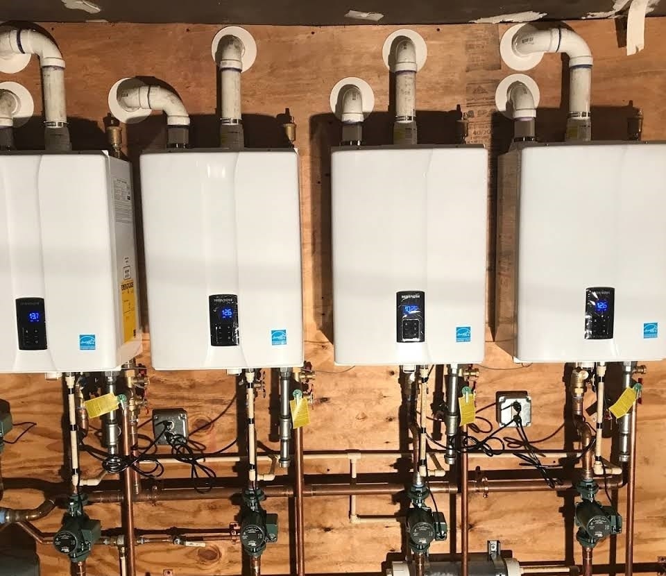 Four tankless water heaters installed at a residence in Austin, Texas