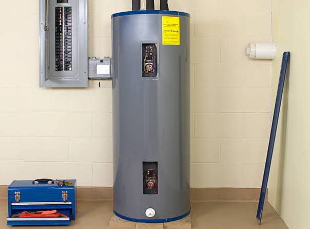 A residential tank-style gas water heater in Austin, TX