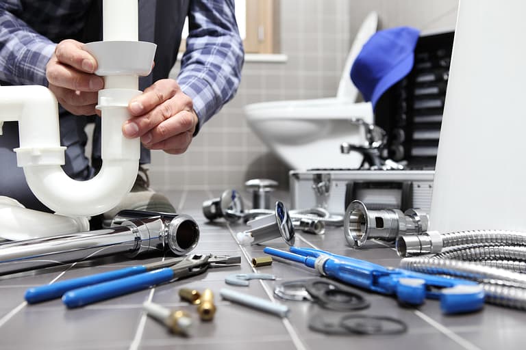 A plumber performing a plumbing inspection, installation, and repair in the Austin, TX area.